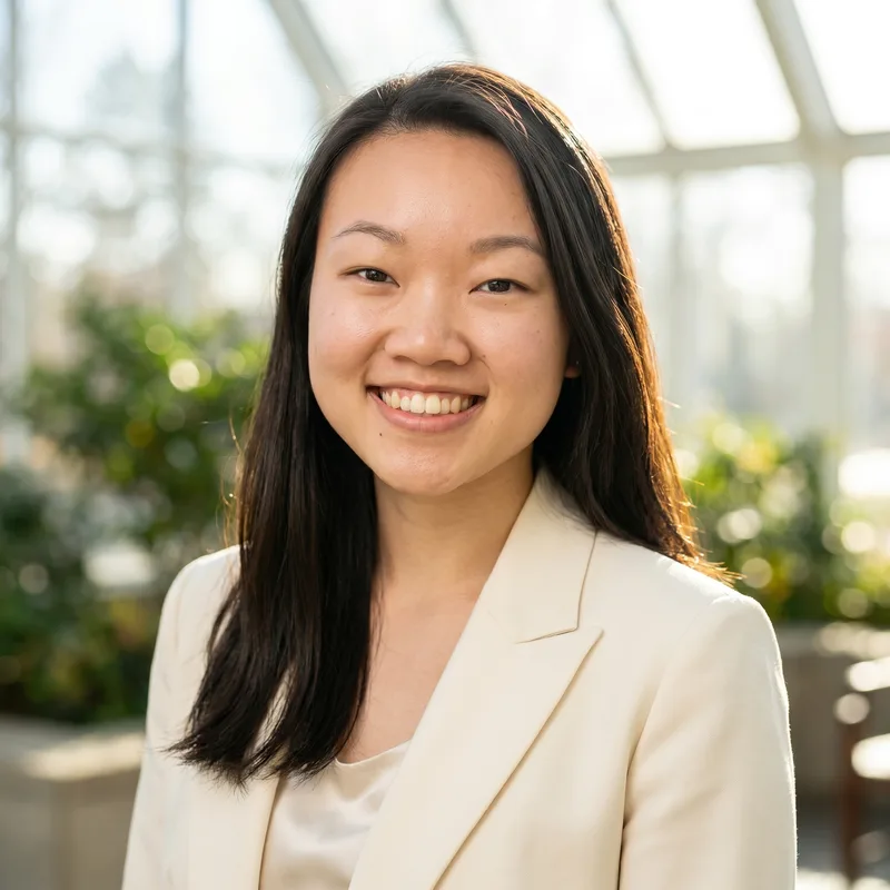 Professional headshot of Dominique Huang